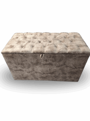 Plush taupe-grey tufted storage ottoman with soft velvet texture and lift-top lid.