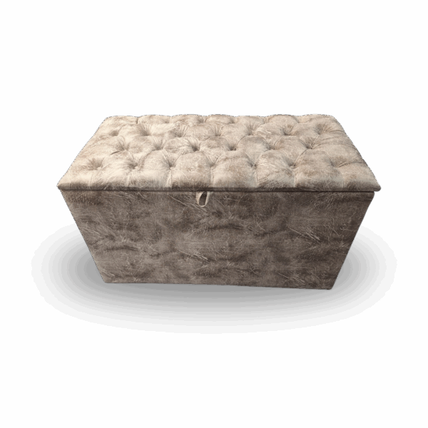 Plush taupe-grey tufted storage ottoman with soft velvet texture and lift-top lid.